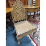 A CARVED EASTERN HARDWOOD CHAIR