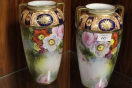 A PAIR OF GILT TOPPED FLORAL NORITAKE VASES