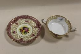 A HAND PAINTED ROYAL WORCESTER TWIN HANDLED BOWL AND SUACER STAMPED HENRY MORGAN & Co LTD. COLONIAL