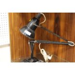 A VINTAGE ANGLEPOISE LAMP ON STEPPED SQUARE BASE