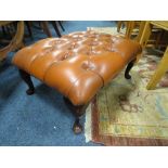 A LEATHER FOOTSTOOL