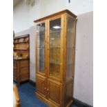 A DUCAL PINE GLAZED DISPLAY CABINET H- 188 CM W-93 CM