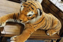 A LARGE SOFT TOY TIGER