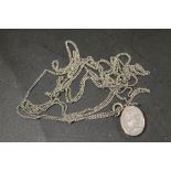 ANTIQUE SILVER LOCKET ON SILVER LONG / MUFF CHAIN