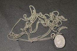 ANTIQUE SILVER LOCKET ON SILVER LONG / MUFF CHAIN