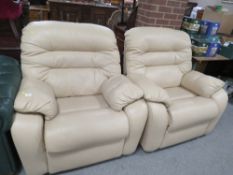 A PAIR OF MODERN CREAM LEATHER ARMCHAIRS