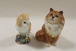A BESWICK MODEL OF A SEATED CAT 1880 TOGETHER WITH A MODEL OF AN OWL (2)