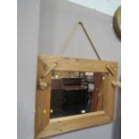 A RUSTIC PINE FRAMED WALL MIRROR 71 CM X 90 CM