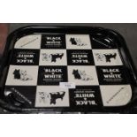 A VINTAGE BLACK AND WHITE WHISKY DRINKS TRAY