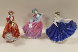 THREE ROYAL DOULTON FIGURINES CONSISTING OF TOP O THE HILL, AUTUMN BREEZES AND ELAINE