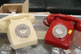 A VINTAGE RED TELEPHONE TOGETHER WITH A CREAM EXAMPLE (2)