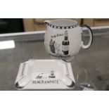 A VINTAGE BLACK AND WHITE WHISKY "ITS THE SCOTCH" JUG AND MATCHING ASHTRAY