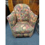 A CHILDS VINTAGE UPHOLSTERED ARMCHAIR