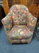 A CHILDS VINTAGE UPHOLSTERED ARMCHAIR