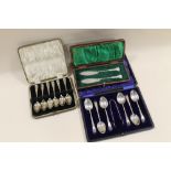 THREE CASED HALLMARKED SILVER SETS TO INCLUDE AN ORNATE PAIR OF ROPE TWIST STEM BUTTER KNIFES
