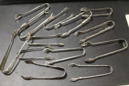 A COLLECTION OF 13 SILVER TONGS, ICE TONGS ETC
