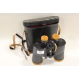 A CASED SET OF TECNAR 7 X 50 372FT AT 1000 YARDS COATED OPTIC BINOCULARS