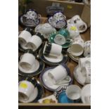 A TRAY OF ASSORTED CERAMIC COFFEE CUPS AND SAUCER TO INCLUDE WEDGWOOD , ROYAL DOULTON, ROYAL