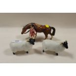 TWO BESWICK SHEEP TOGETHER WITH AN UNMARKED HUNTSMAN FIGURE (3)