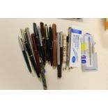 A SMALL TUB OF VARIOUS PENS, PROPELLING PENS, BIROS AND ITEMS FOR SPARES AND REPAIRS