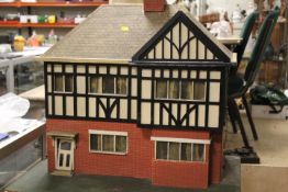 A VINTAGE DOLLS HOUSE COMPLETE WITH FURNITURE