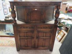 A VINTAGE OAK COURT CUPBOARD