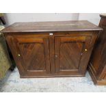 A VINTAGE PINE TWO DOOR CUPBOARD W-125 CM