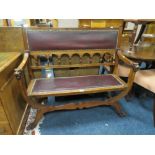 AN UNUSUAL VINTAGE OAK ARTS AND CRAFTS STYLE BENCH SEAT WITH MASK HEAD CARVED DETAIL W-112 CM