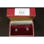 A PAIR OF 9CT GOLD, DIAMOND AND AQUAMARINE STUD EARRINGS