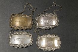 FOUR HALLMARKED SILVER WINE LABLES