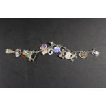 A VINTAGE SILVER CHARM BRACELET