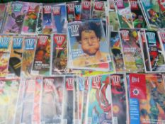 A BOX CONTAINING 2000AD COMICS FEATURING JUDGE DREDD, FROM THE EARLY 1990S, RUNNING FROM PROGRAMME