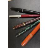 FOUR VINTAGE FOUNTAIN PENS TO INCLUDE PARKER PENS AND A PROPELLING PENCIL