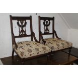 A PAIR OF EDWARDIAN MAHOGANY CARVED CHILDS CHAIRS