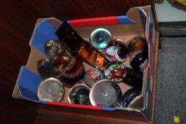 A TRAY OF ASSORTED GLASS PAPERWEIGHTS