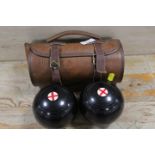 A CASED SET OF LAWN BOWLS