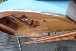 A SMALL WOODEN 11FT SAIL BOAT