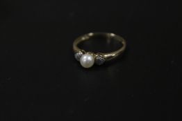 A 375 GOLD SEED PEARL AND DIAMOND RING APPROX WEIGHT 1.7G