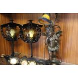 A SPELTER CHERUB TABLE LAMP, A PAIR OF MATCHING BLACK METAL TABLE LAMPS AND THREE HORSE BRASS