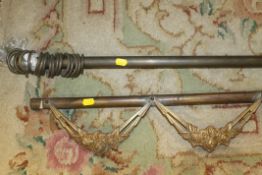 A BRASS CURTAIN RAIL AND METAL CURTAIN POLE EMBELLISHMENT (2)