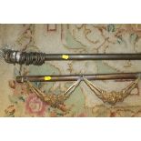 A BRASS CURTAIN RAIL AND METAL CURTAIN POLE EMBELLISHMENT (2)