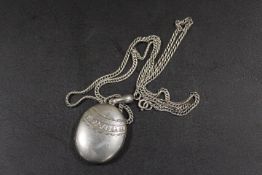 A LARGE VICTORIAN LOCKET ON ANTIQUE SILVER CHAIN