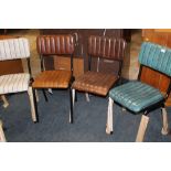 A HARLEQUIN SET OF FOUR MODERN LEATHER DINING CHAIRS