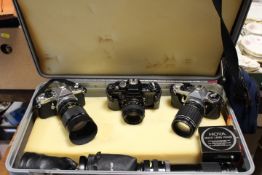A HARD SHELL TRAVEL CASE SEVERAL CAMERA AND LENS TO INCLUDE PRACTICAL AND PENTAX EXAMPLES