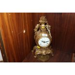 A IMPERIAL GILT METAL MANTLE CLOCK