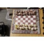 A SMALL MARBLE STYLE CHESS SET