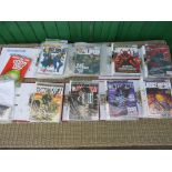 A BOX CONTAINING 8 FOLDERS OF 2000AD JUDGE DREDD COMICS FROM 2004 TO 2009
