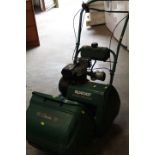 A QUALCAST CLASSIC PETROL MOWER WITH BOX