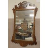 A 19TH CENTURY WALNUT MIRROR, of rectangular form, with pierced surmount, 81.5 x 47 cm