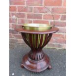 AN EDWARDIAN MAHOGANY INLAID JARDINIERE STAND, with swing handle, H 44 cm
